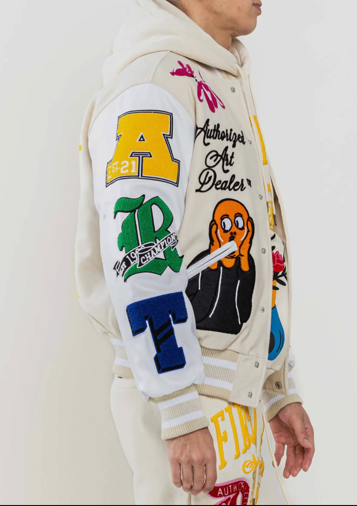 FIRST ROW: ART DEALER CREAM VARSITY JACKET – 85 86