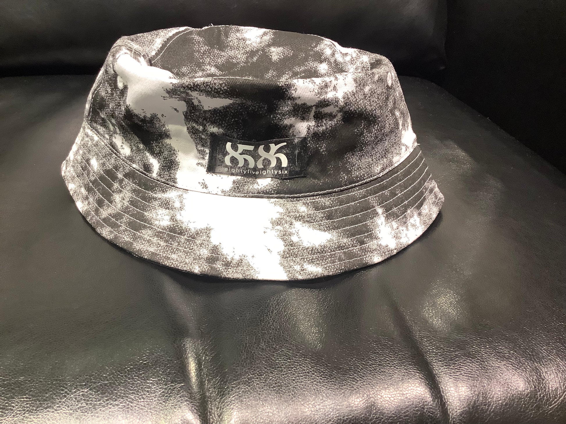 8586: BLACK AND WHITE BUCKET HAT (digitally printed design) up close 