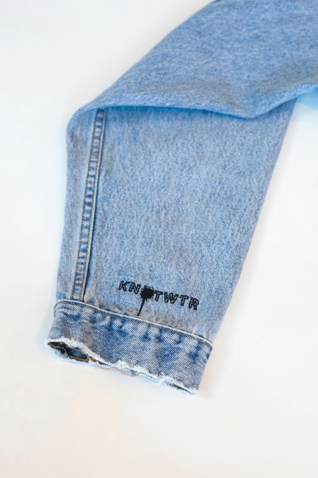 KNOTWTR: CyberTron Denim Crop Top close up arm view