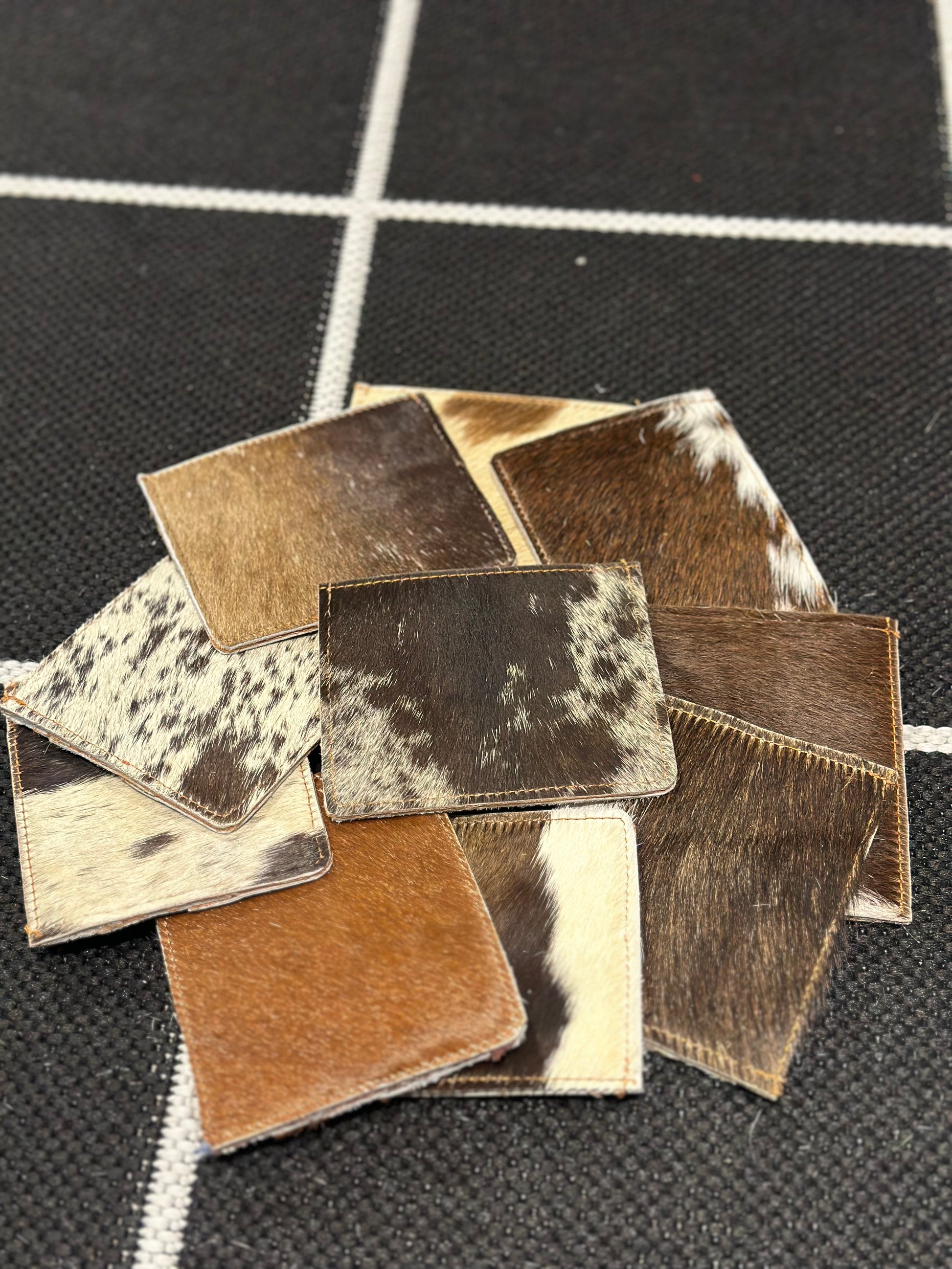 NYRVA: MULTI BROWN  COWHIDE CARD HOLDER (back view)