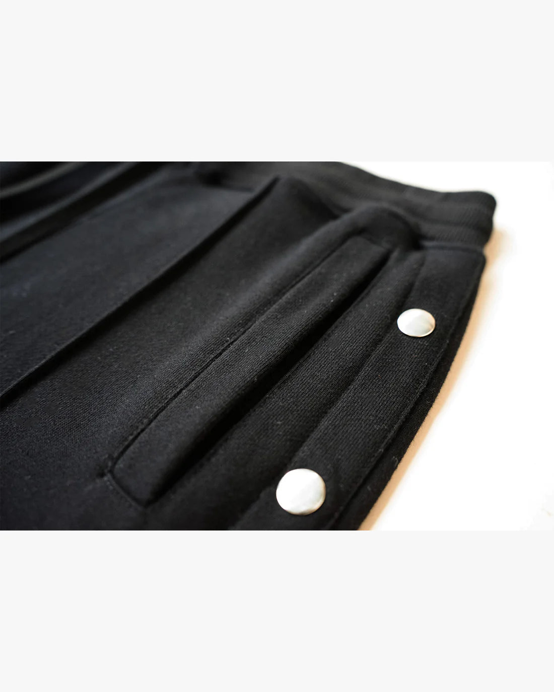 EPTM: FRENCH TERRY SNAP FLARED PANTS BLACK(flat lay close up view)