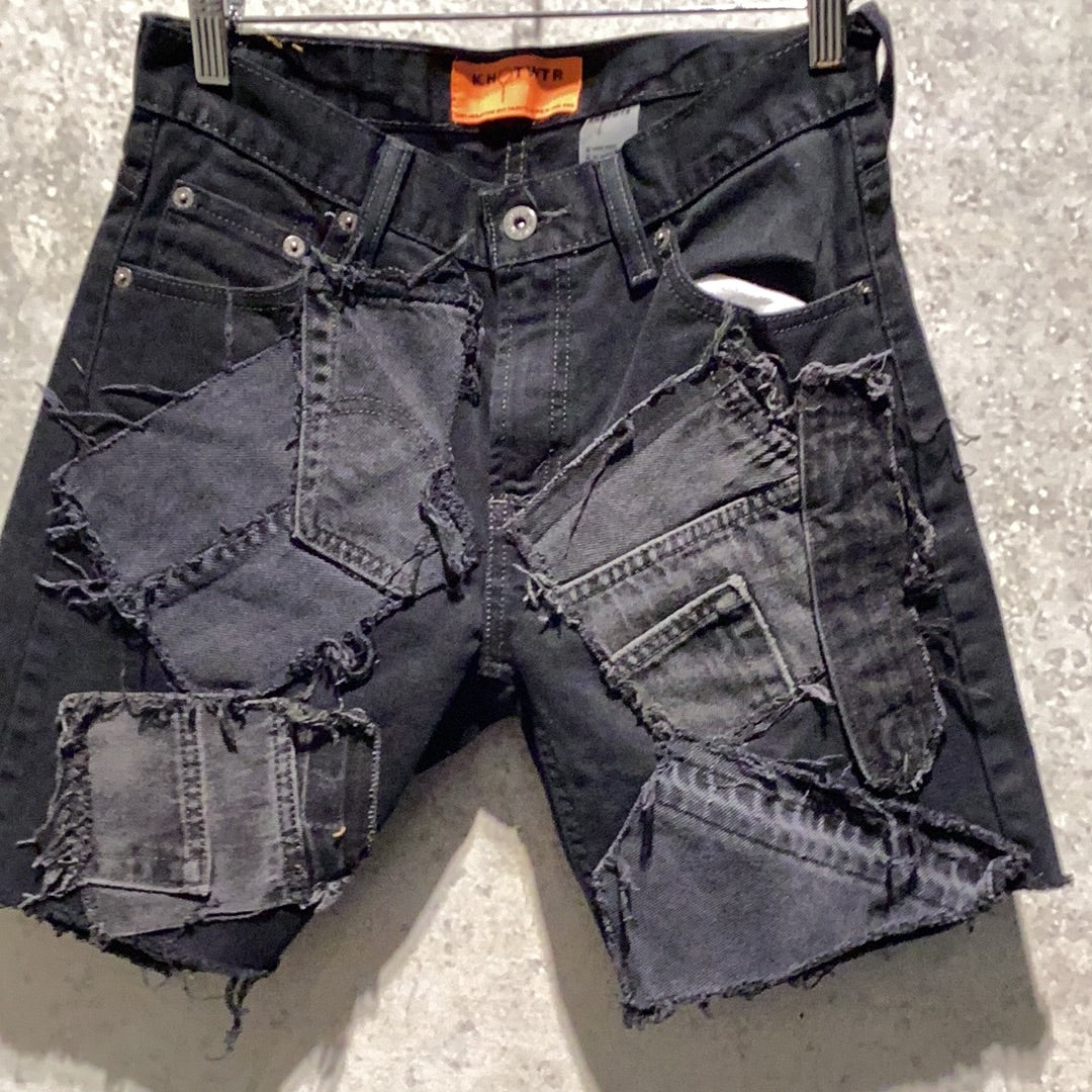 KNOTWTR: BLACK PATCHWORK DENIM SHORTS (front view)