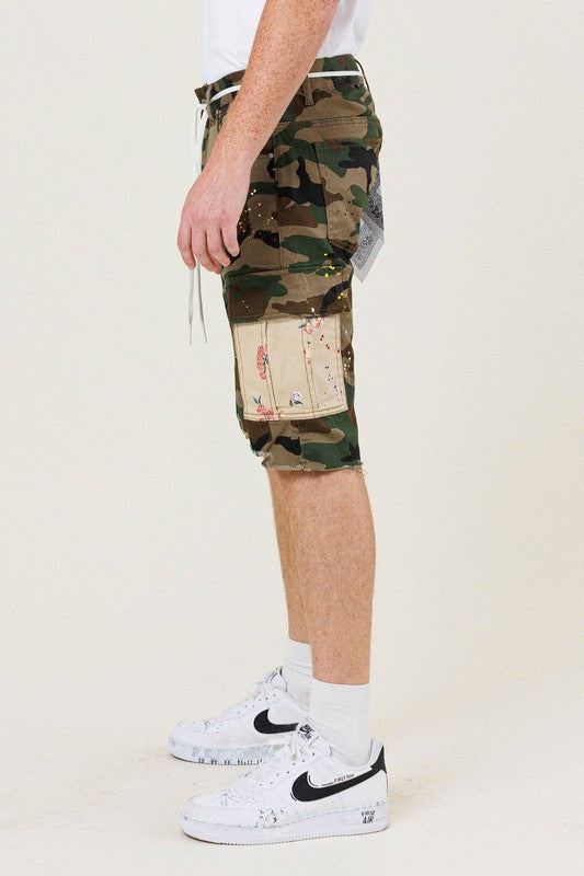 FIRST ROW: CAMO FLOWER PATCH CARGO SHORTS side view on model